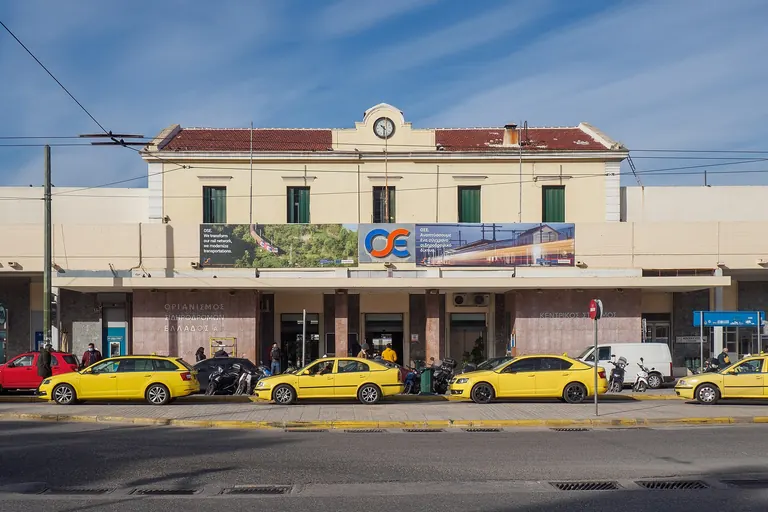 The front of Larissa station in Athens, where the trains to the north leave from, with taxis waiting outside.