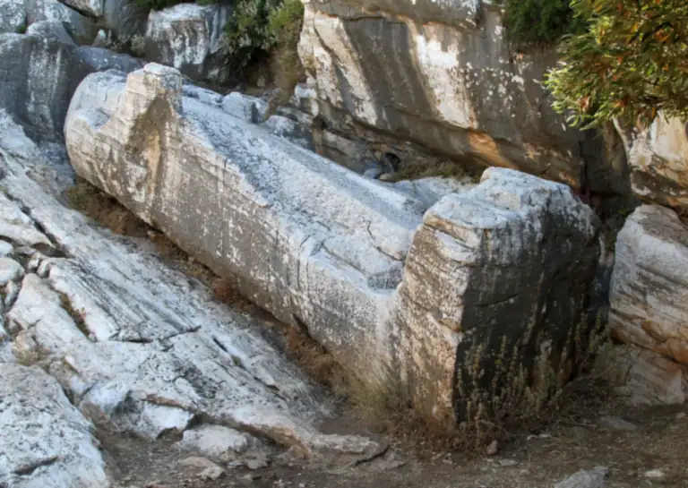 The unfinished marble kouros lying in its quarry near Apollonas, Naxos.
