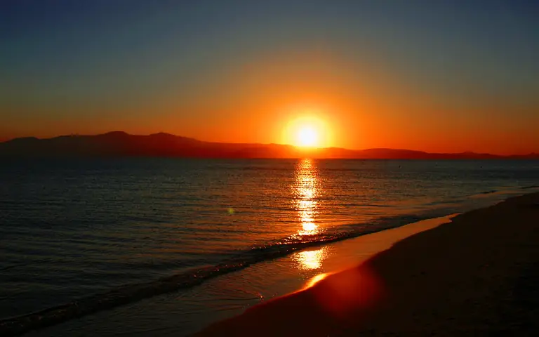 Sunset over the sea at Plaka beach, Naxos.
