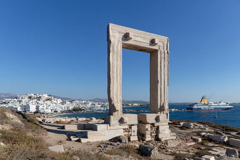 The Portara, the marble doorway of the unfinished temple of Apollo, on its islet by Naxos town.