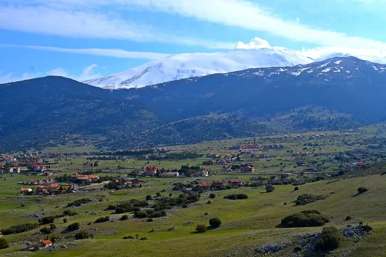 Snow on the peaks of Mount Parnassus above the Livadi plateau, in spring.