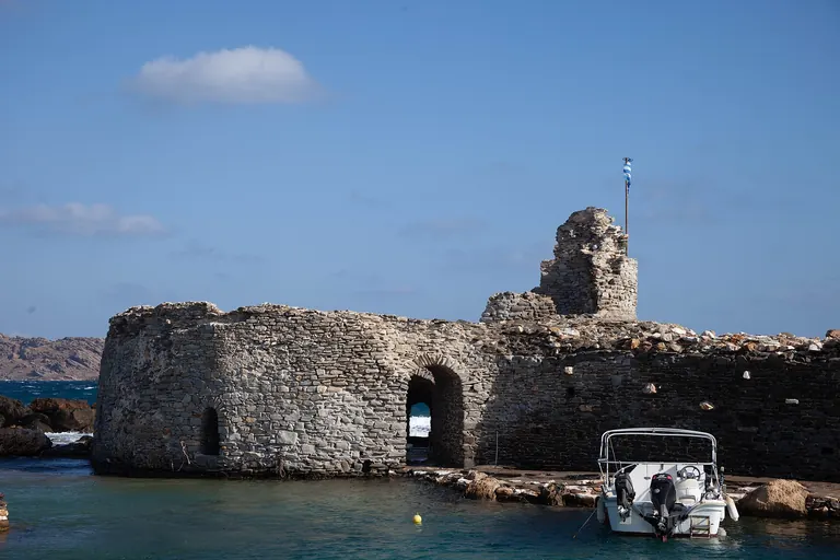 The ruined Venetian castle at the mouth of Naoussa harbor, Paros.