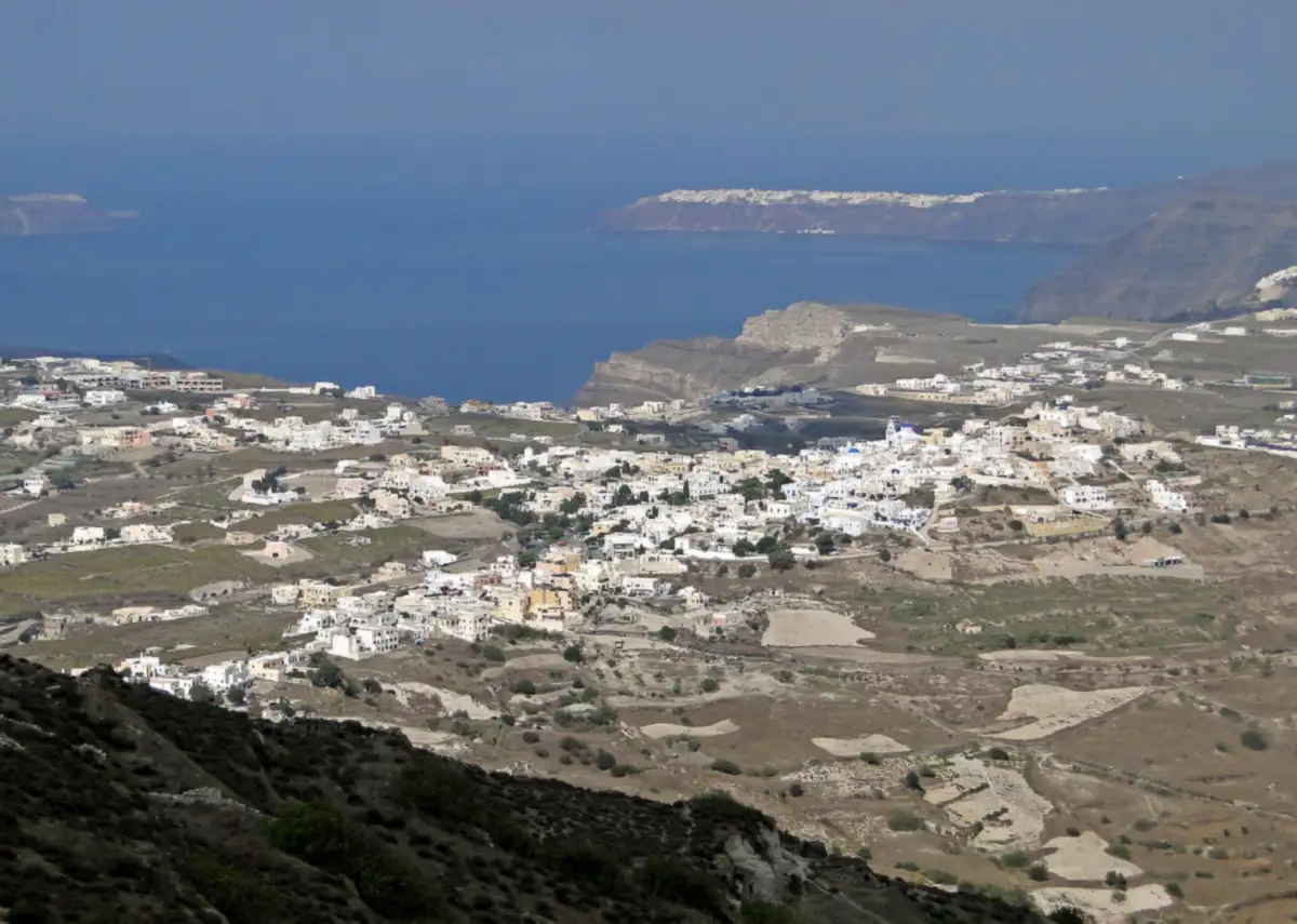 The village of Pyrgos on its hill in the middle of Santorini, with the caldera beyond.